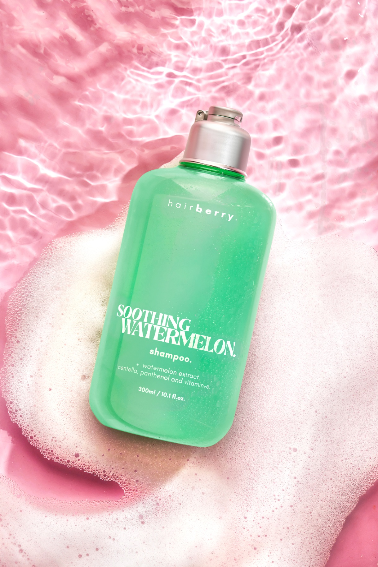 Hairberry Soothing Watermelon Shampoo in pink water with foam styling